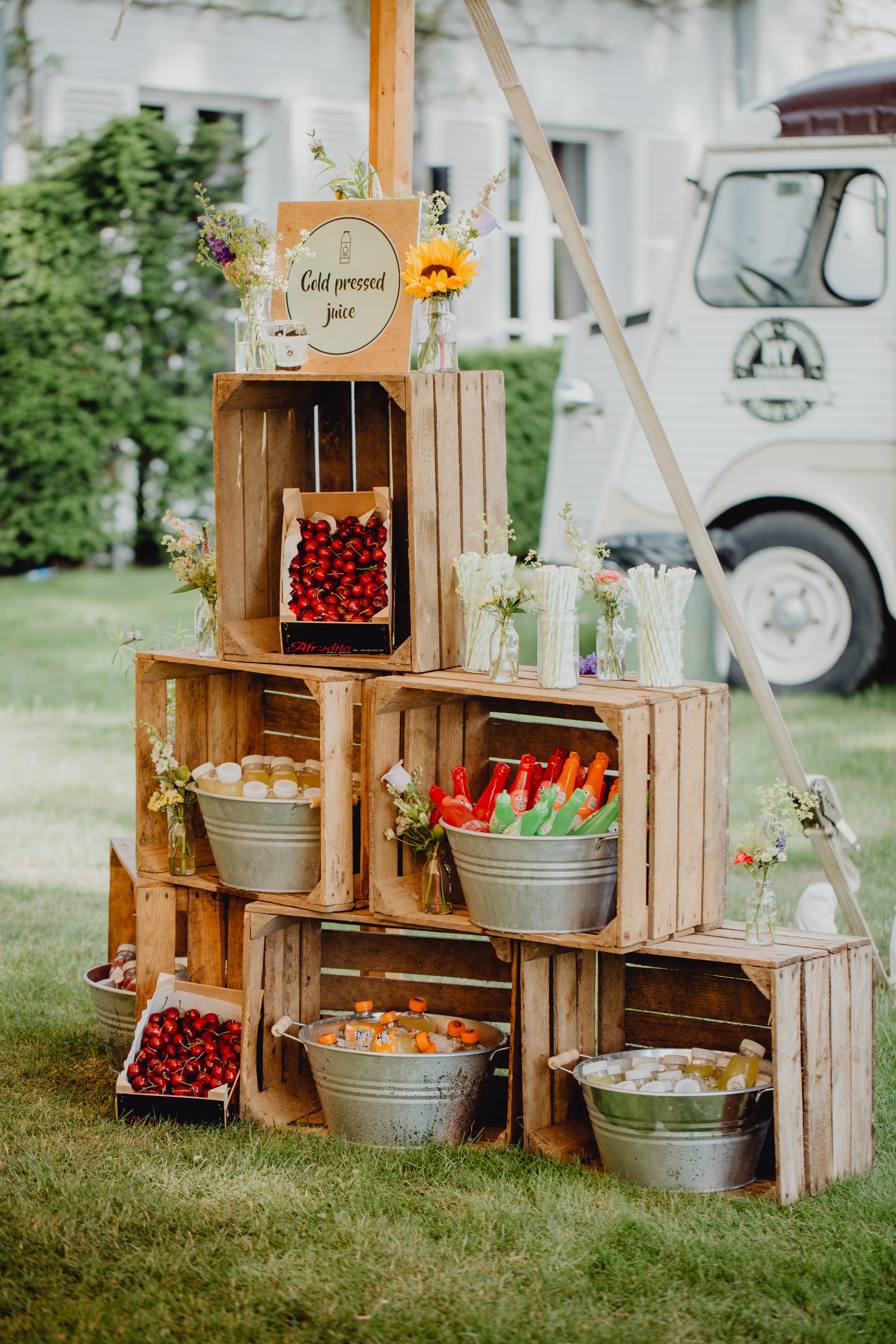 wooden boxes with food and flowers