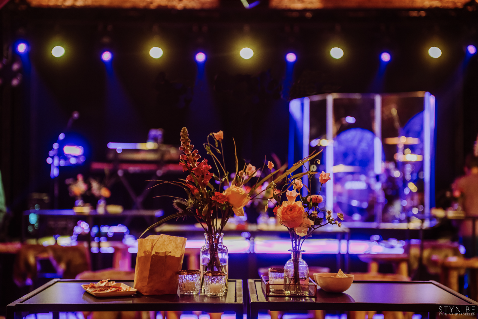 vases with flowers on reception tables