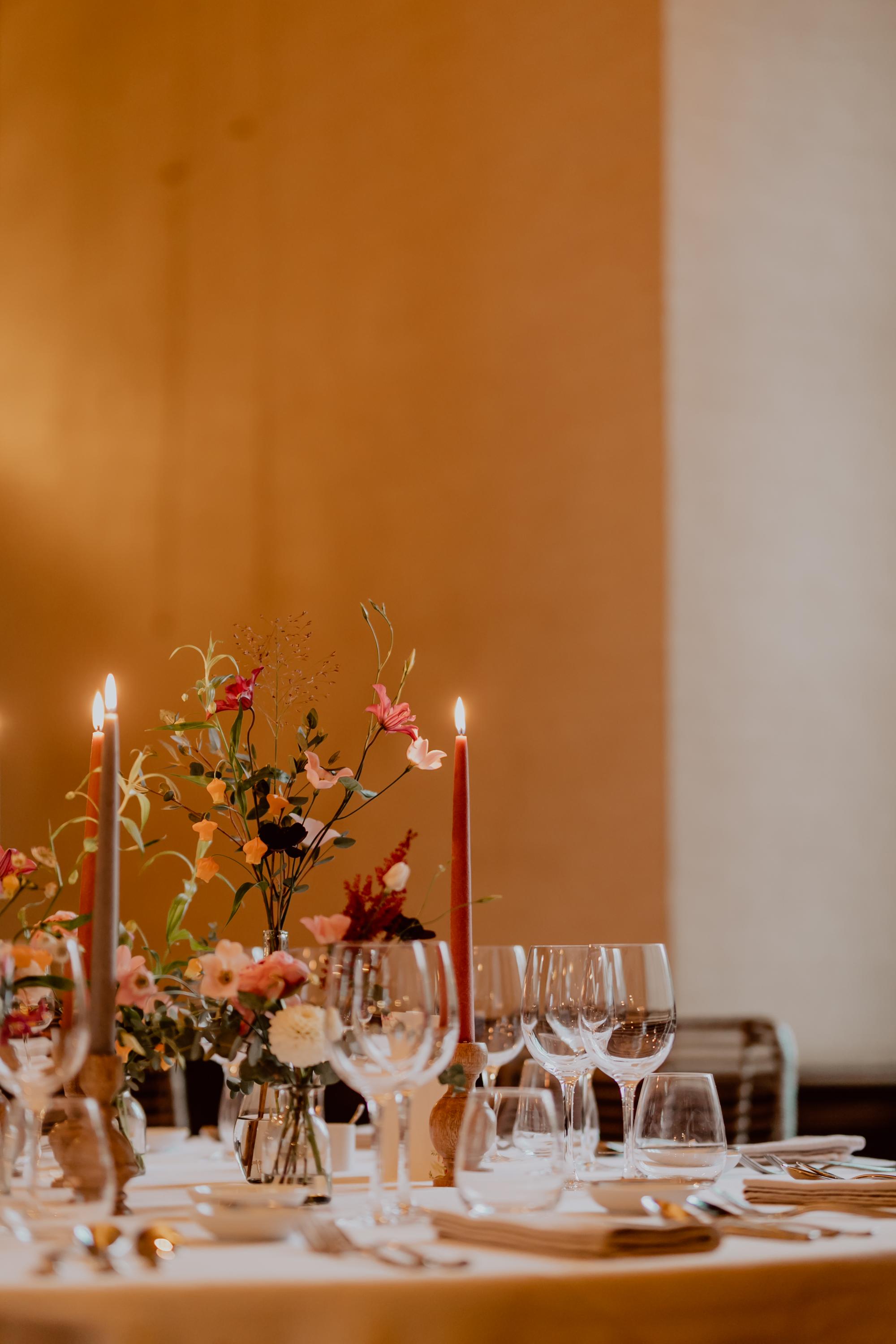 table setting with flowers and candles