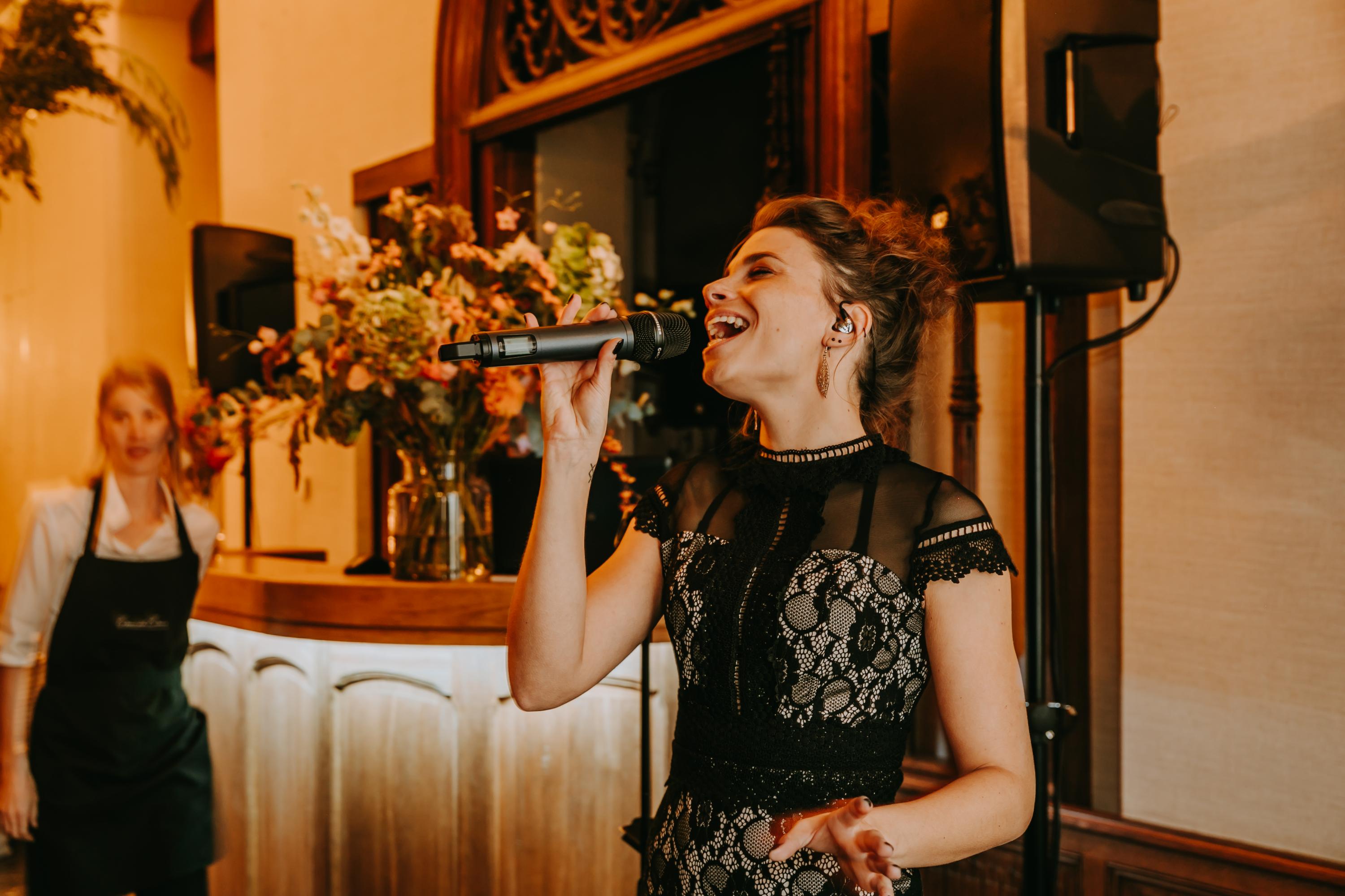singer with on the background flowers in vases